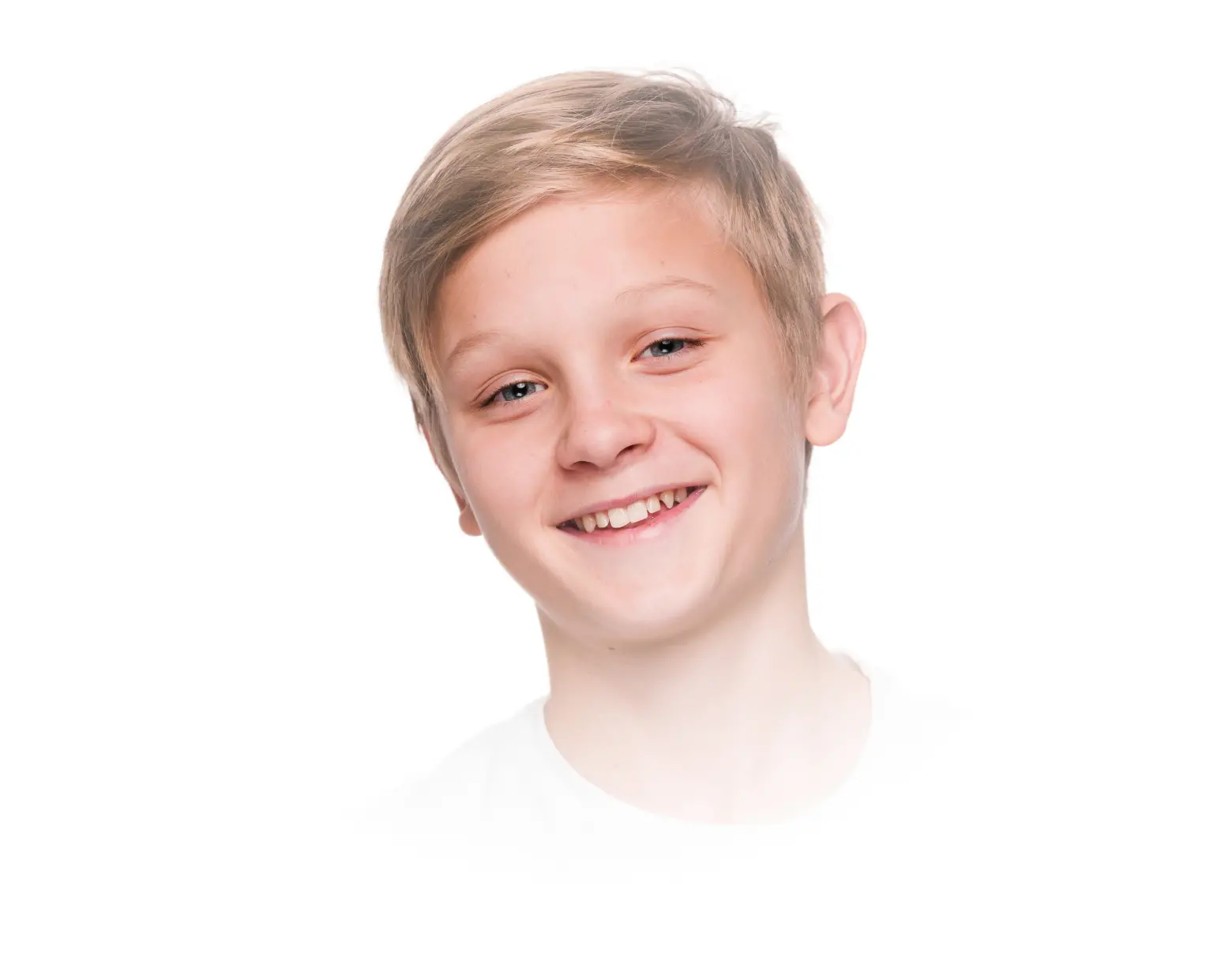 Smiling boy with short blonde hair, representing pediatric dentistry and children's dental health at La Clinica Dental.